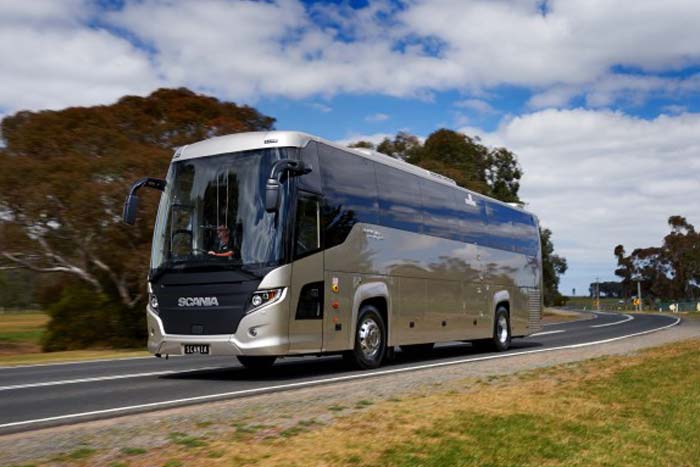 Passengers boarding a bus for a thrilling snow trip to Mt Buller
